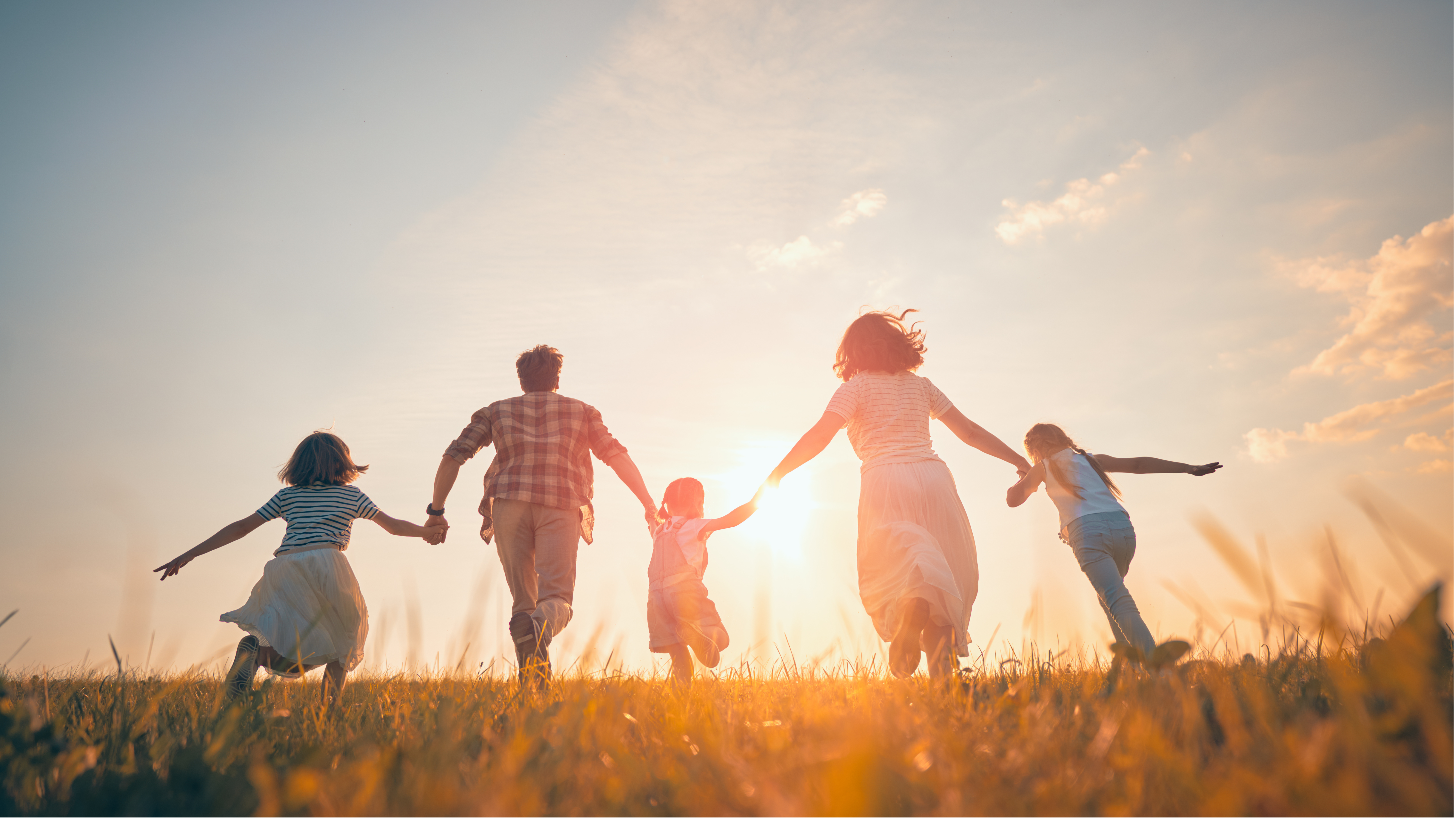 A family holding hands together, symbolizing unity, support, and shared financial goals